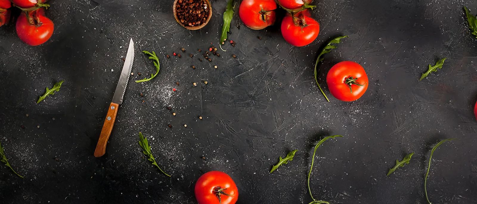 Cutting board with tomatoes and seasonings